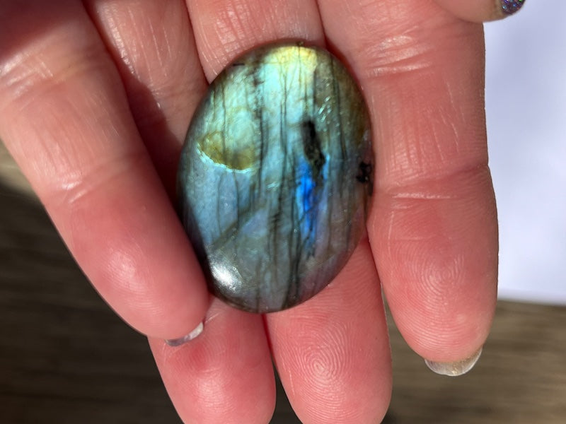 Labradorite Oval Cabochons with varing Blue, orange, yellow and purple flash.