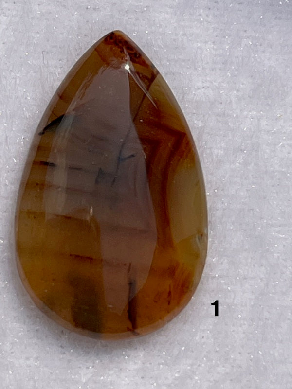 Multi coloured brown lace agate cabochons.