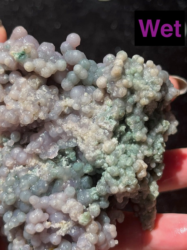 Green and turquoise run through the back of this grape agate cluster