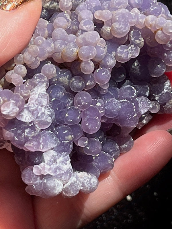 Dark Amethyst grapes shown in the pocket of this crystal