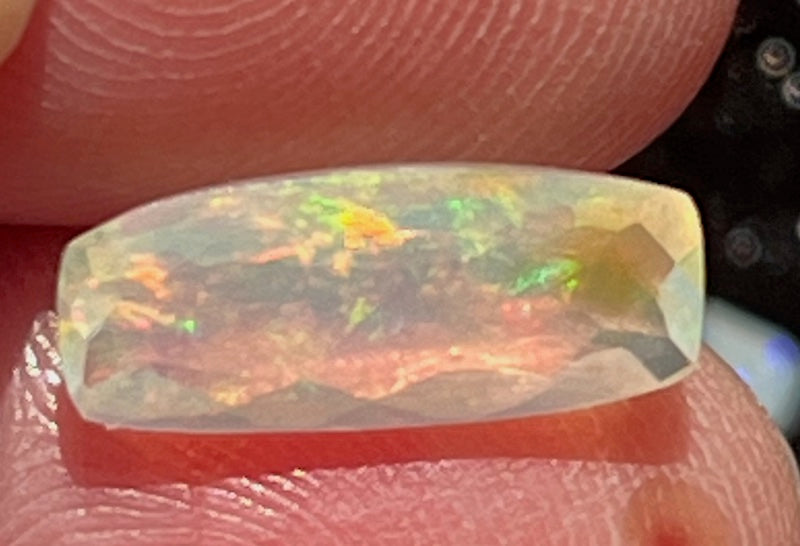 Opals, cushion rectangle shape, pink, blue and yellow flash.