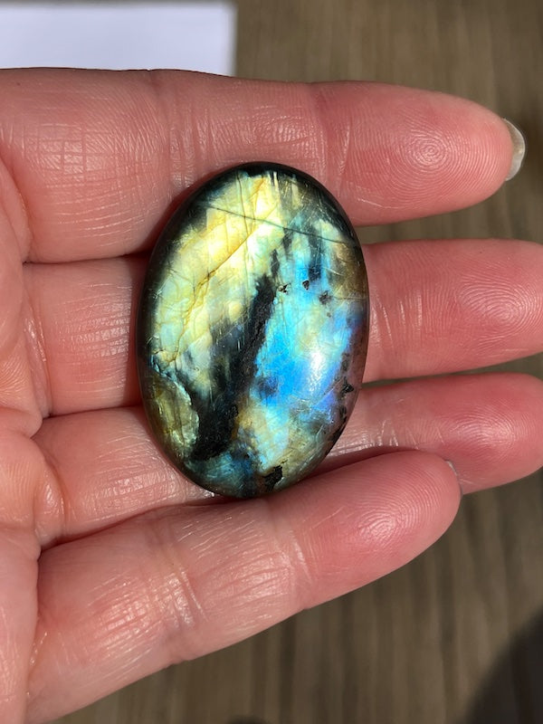 Labradorite Oval Cabochons with varing Blue, orange, yellow and purple flash.