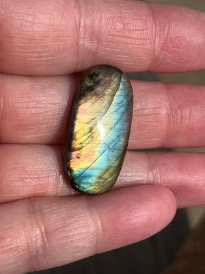 Labradorite Oval Cabochons with varing Blue, orange, yellow and purple flash.