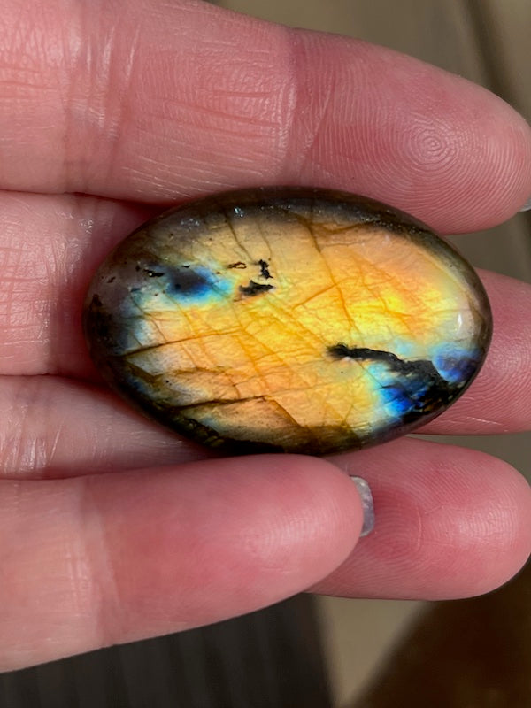 Labradorite Oval Cabochons with varing Blue, orange, yellow and purple flash.