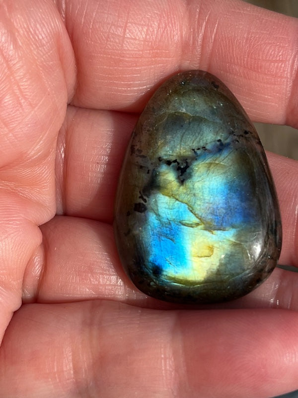Labradorite Oval Cabochons with varing Blue, orange, yellow and purple flash.