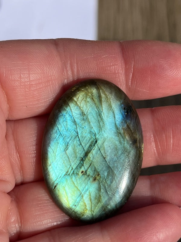Labradorite Oval Cabochons with varing Blue, orange, yellow and purple flash.