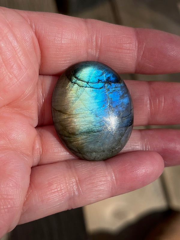 Labradorite Oval Cabochons with varing Blue, orange, yellow and purple flash.