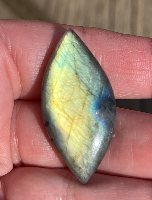 Labradorite Marquise/Eye Cabochons with vering Blue, orange, yellow and purple flash.