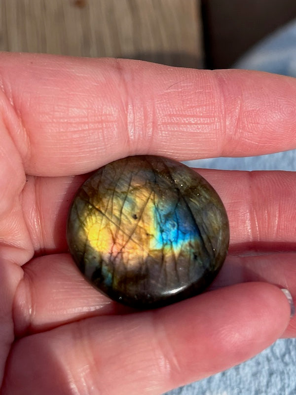 Labradorite Round Cabochons with vering Blue, orange, yellow and purple flash.