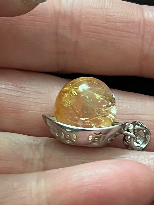 Citrine sphere with natural rainbow inclusions. Chinese ingot design