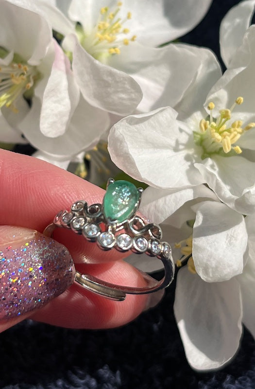Ring, Natural Sparkling Emerald with cz accent set in sterling silver.