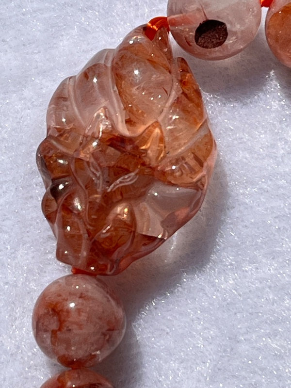 Bracelet, fire quartz round faceted beads with fire quartz 9 tail fox, 10mm beads