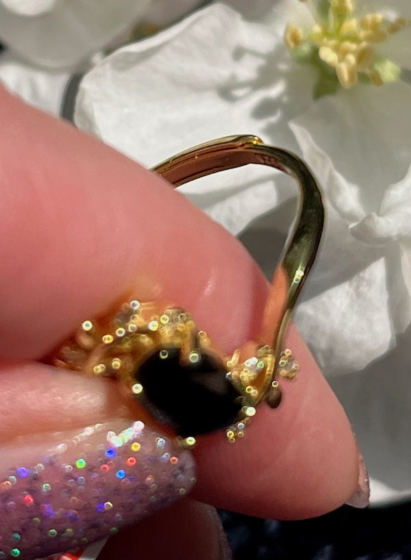 Ring, Black Spinel 5x7mm set in gold filled sterling silver. Size is adjustable