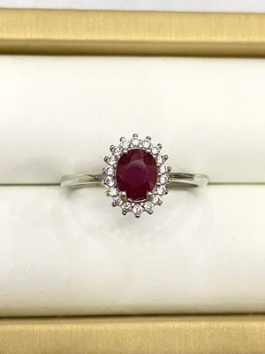 Ring, Genuine large oval Red Ruby surrounded by A+++CZs, set in silver