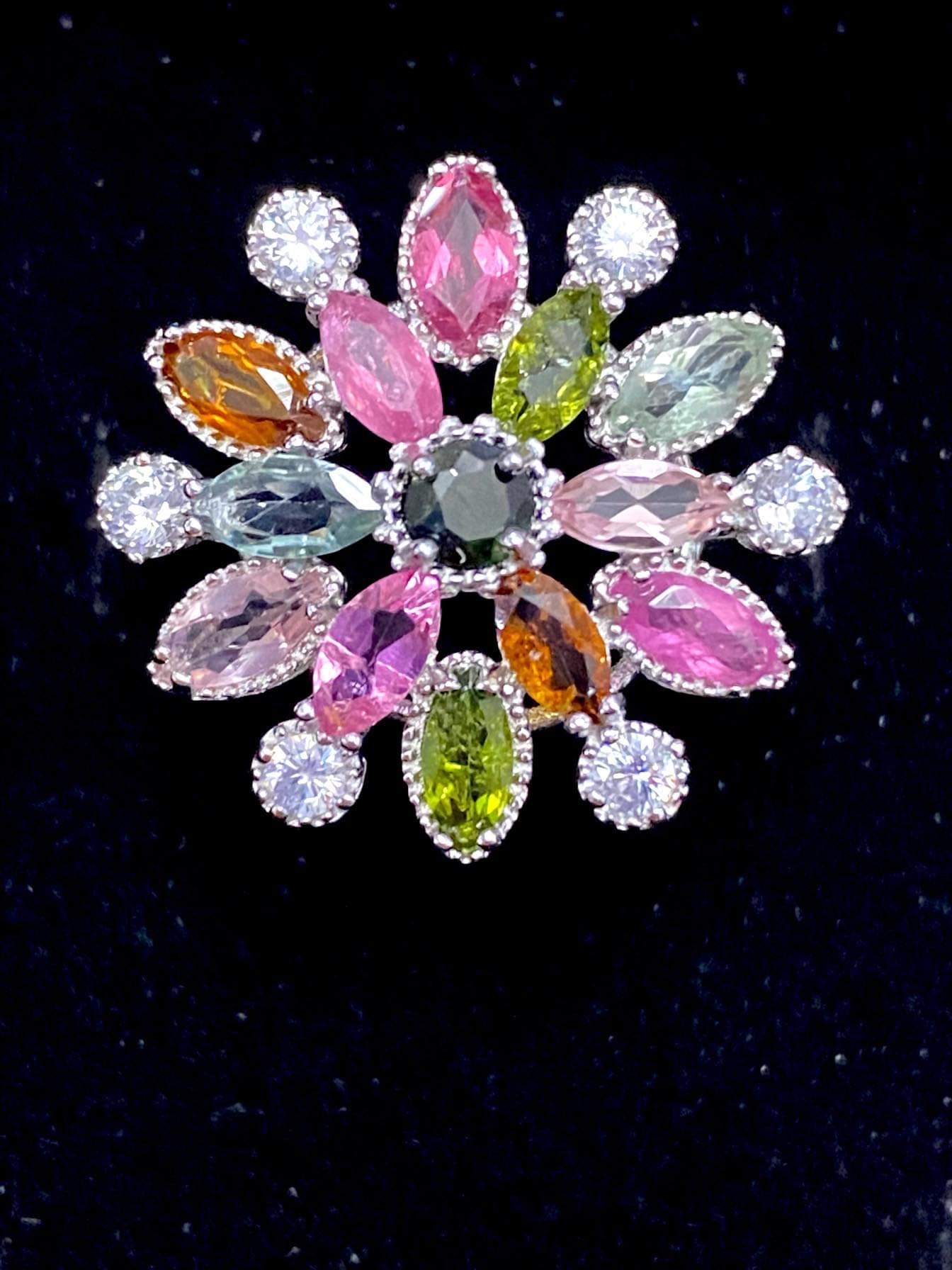 Ring, 12 colourful marquise Tourmalines encircle a round tourmaline set in sterling silver