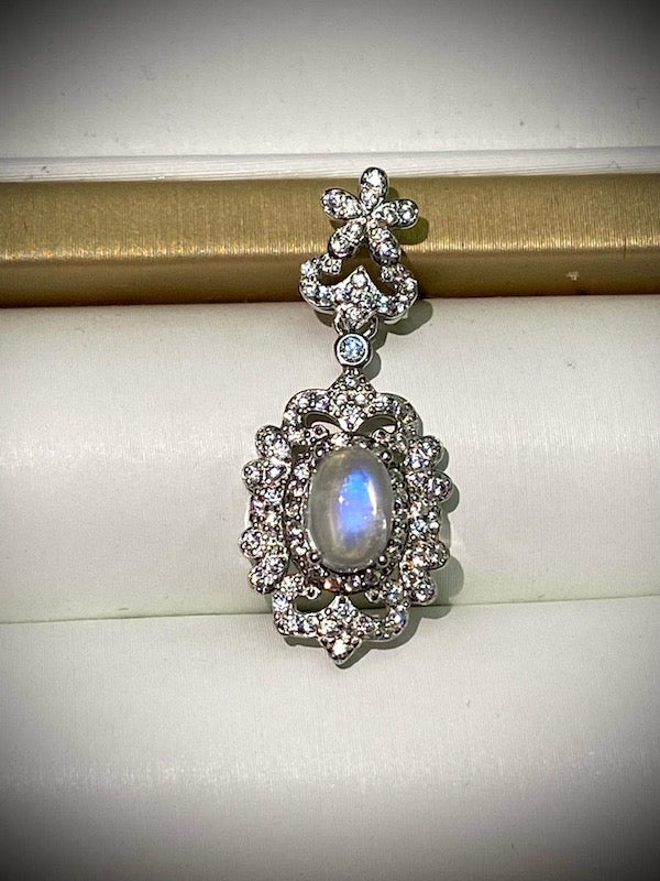 Pendant, moonstone, CZ accent set in sterling silver