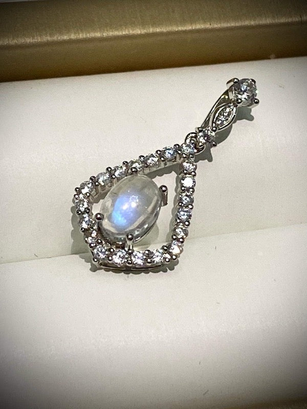 Pendant, Oval moonstone set in a CZ accent pyramid shape.